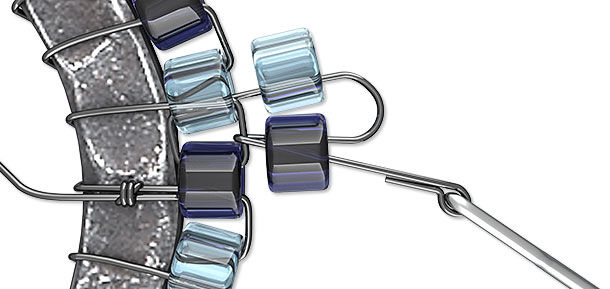 Seed beads being looped onto a ring